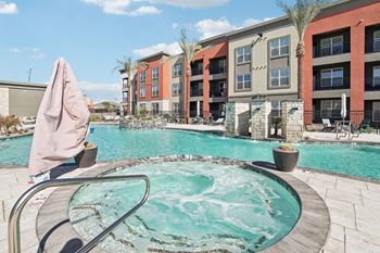 Our apartments have a large swimming pool with an umbrella